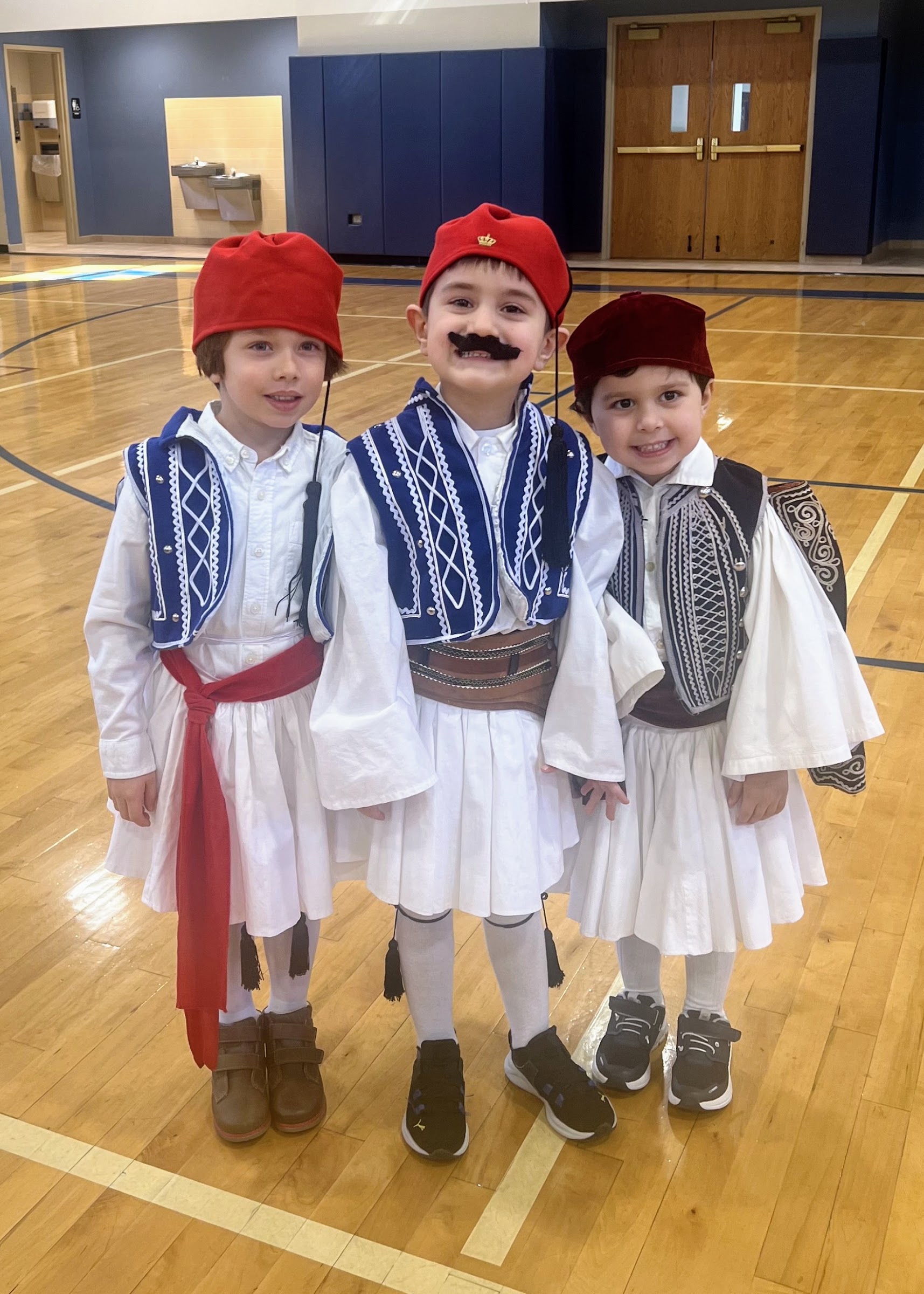Young Greek School students in traditional evzone costumes