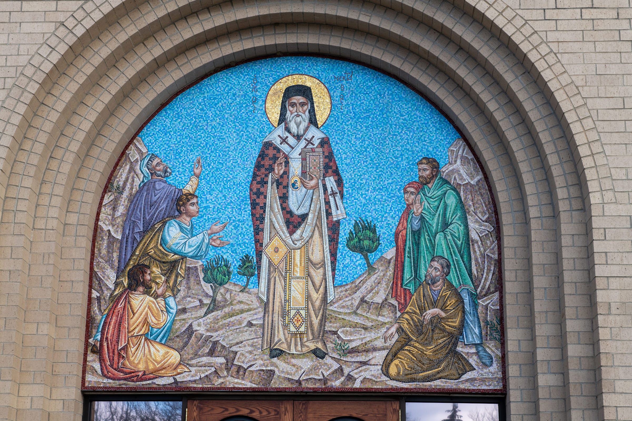 St-Nec-Web-StNec-Aegina-B The church doors beneath the mosaic of Saint Nectarios