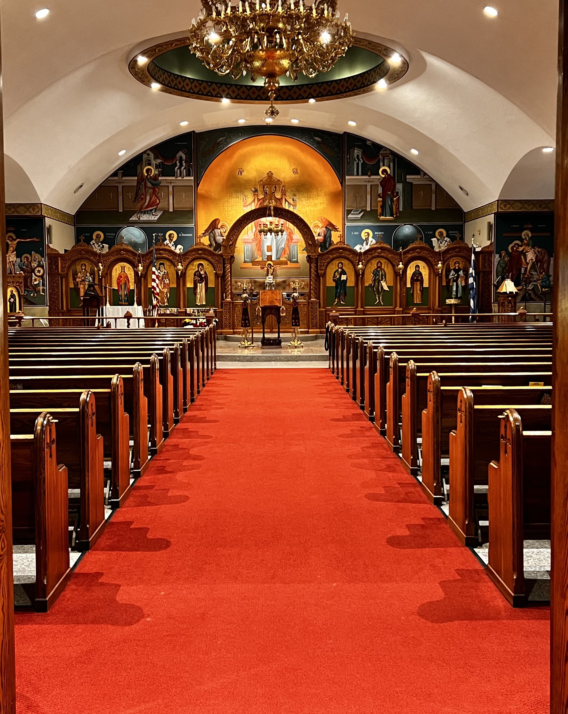 St-Nec-Web-Wedding-Planning-A The church aisle with red carpet and chandelier, ready for a wedding